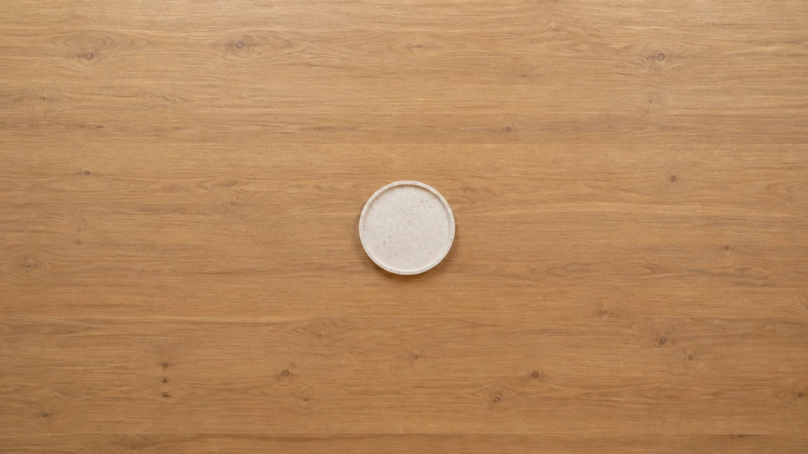 tiny tray marooned in the middle of a very large table top