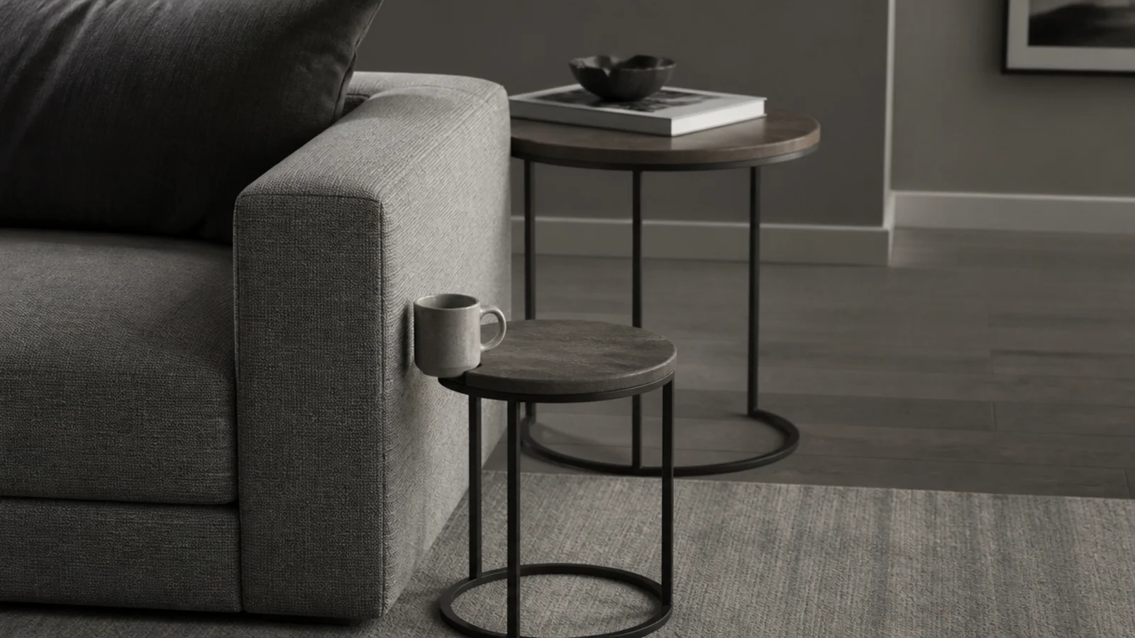small nesting table standing far too low beside a tall sofa arm