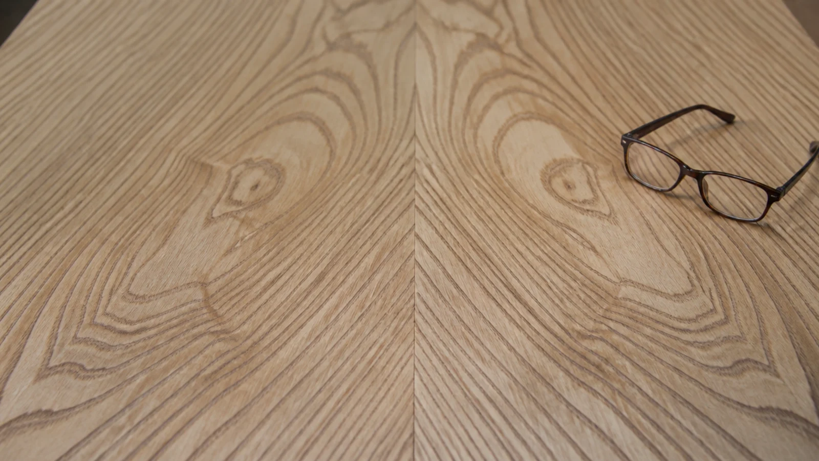 book matched timber top with mirrored grain either side of the joint