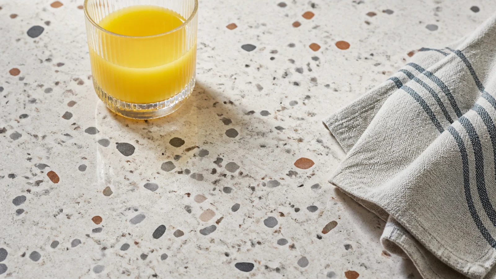 speckled terrazzo table top with coloured aggregate chips throughout