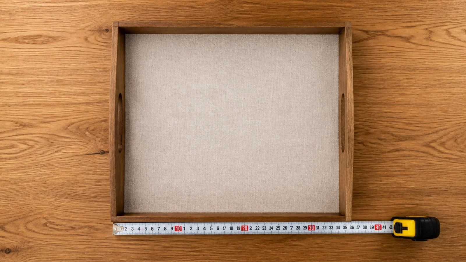 linen lined tray covering roughly a third of a wooden table top
