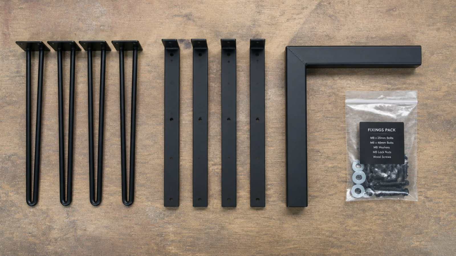 assorted table leg kits and hardware laid out for comparison