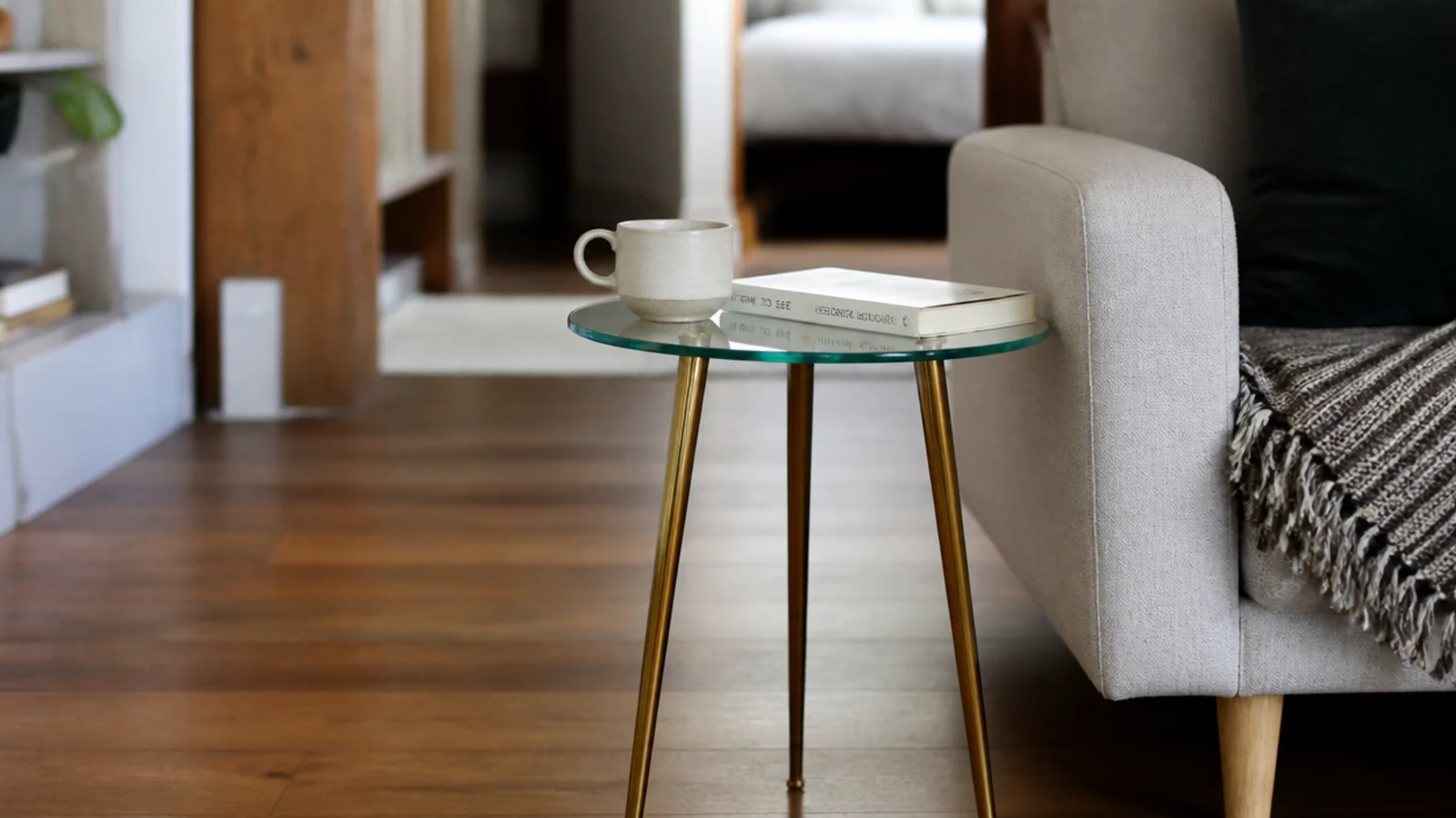 small round glass top on three slim legs in a compact flat