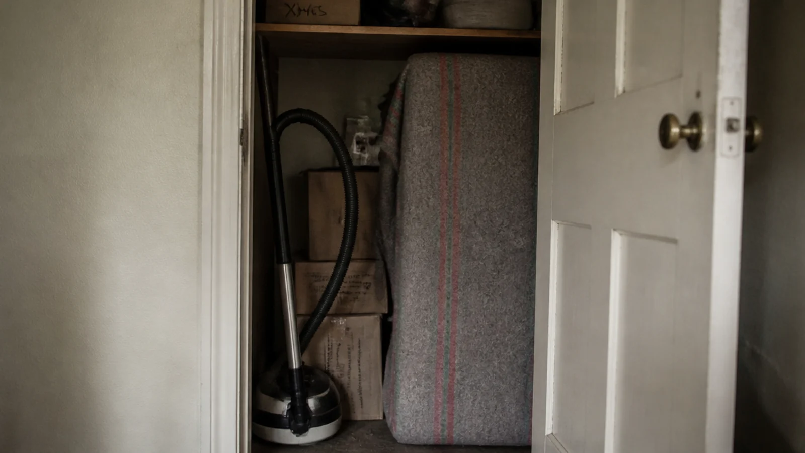 landlord table wrapped in a blanket and stored in a cupboard