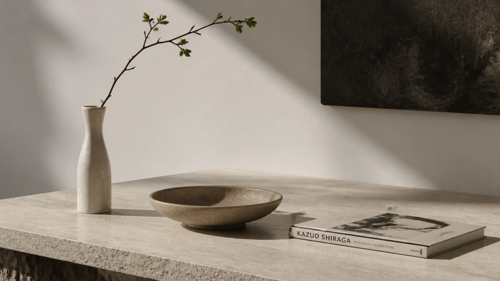 tall stem low bowl and flat book arranged at three distinct heights