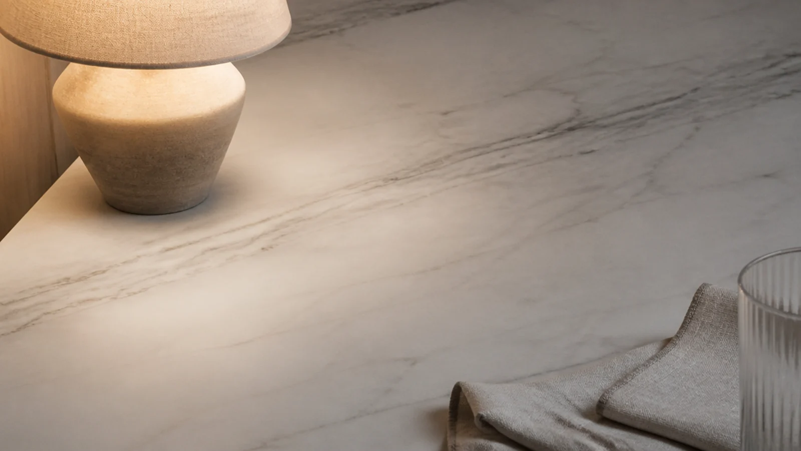 matte honed marble catching soft light with no mirror reflection