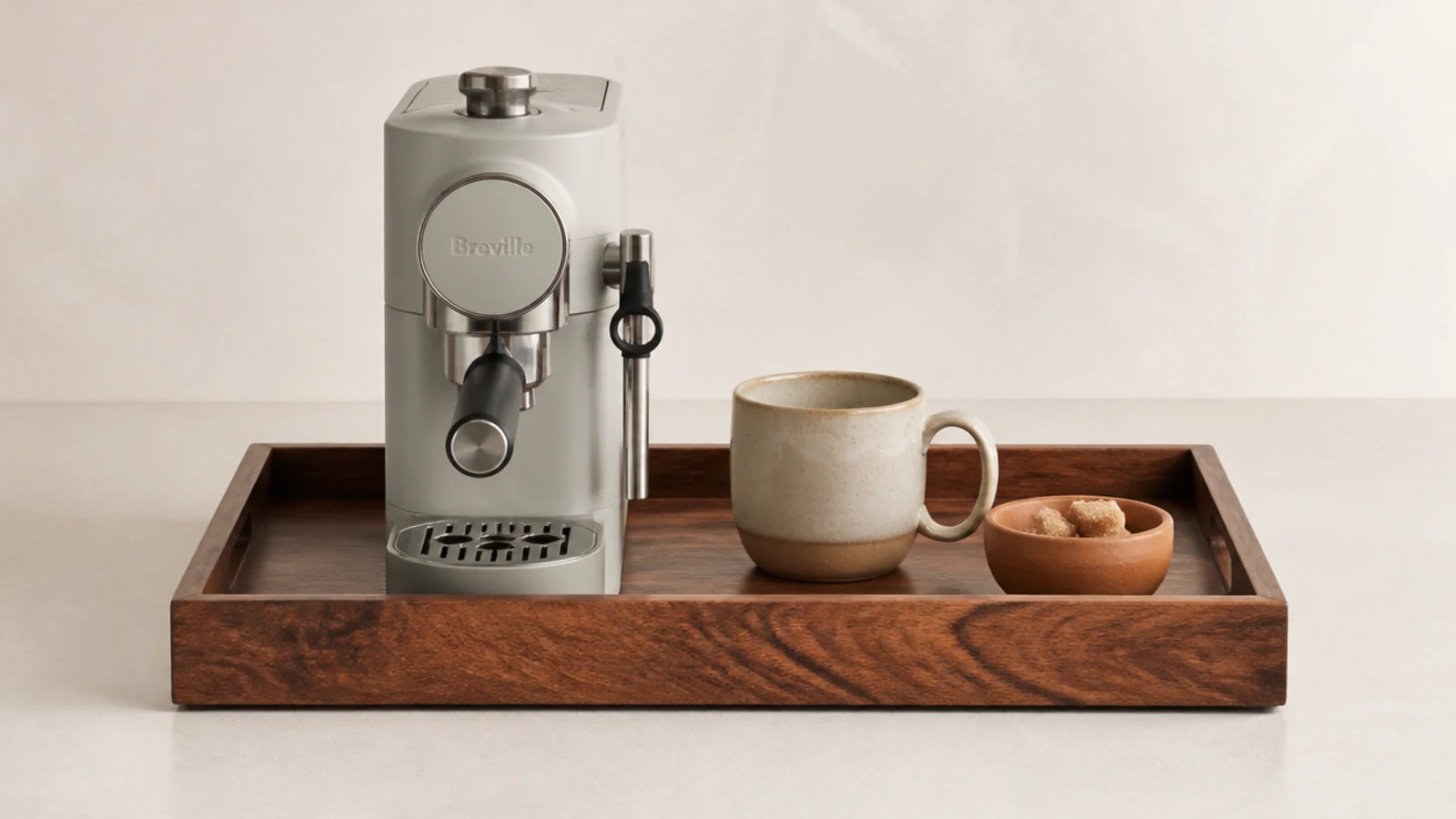 oiled walnut tray with open grain holding a small coffee setup