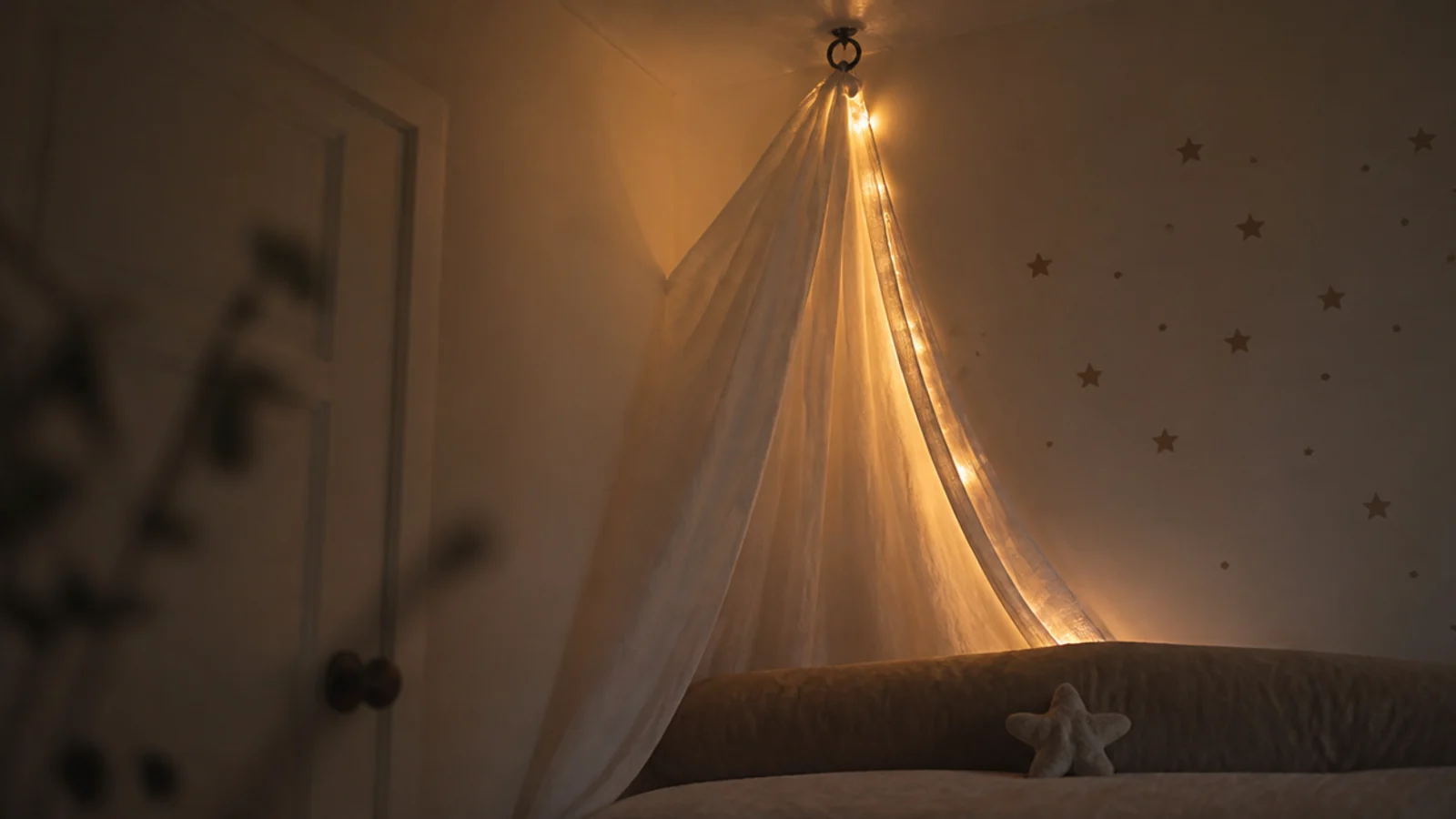 corner of a bed canopy where fabric and lights meet the wall
