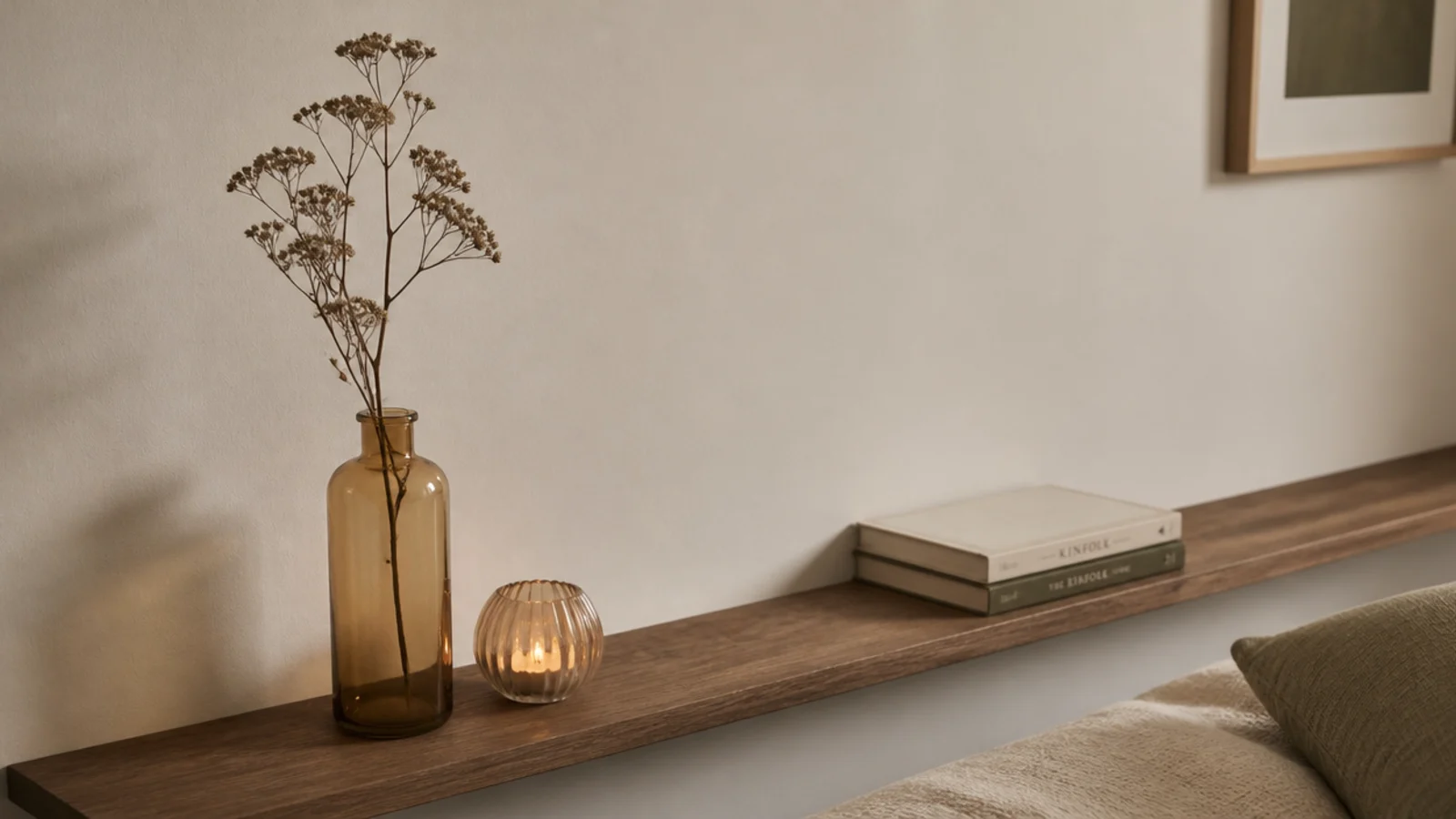 three objects at different heights beside a small lit vessel