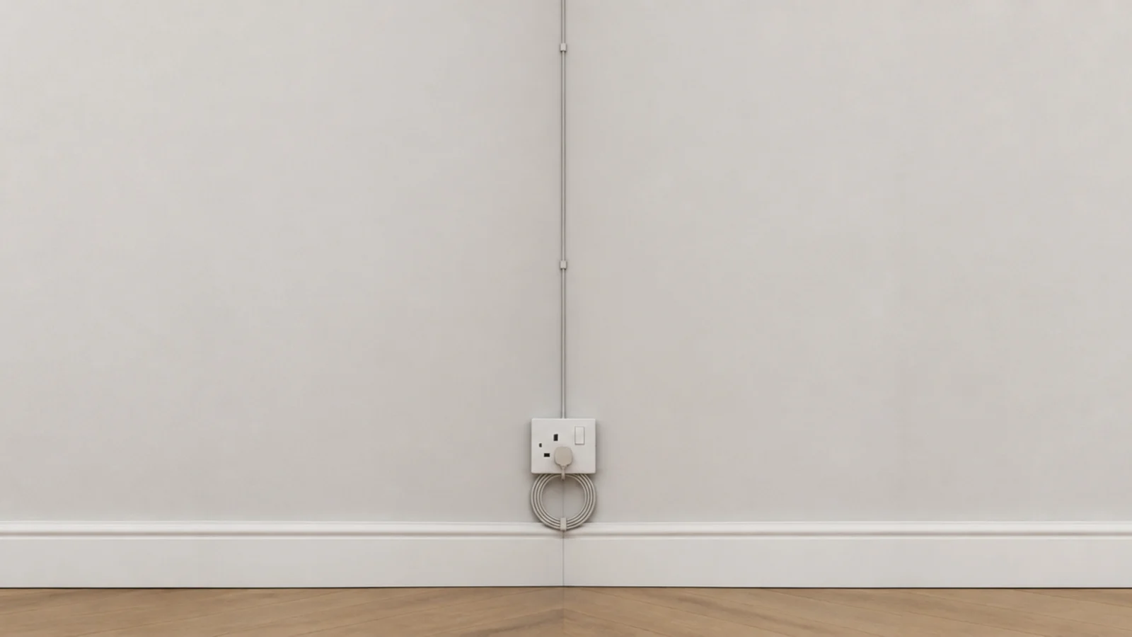 light lead clipped down a wall corner to a floor level socket