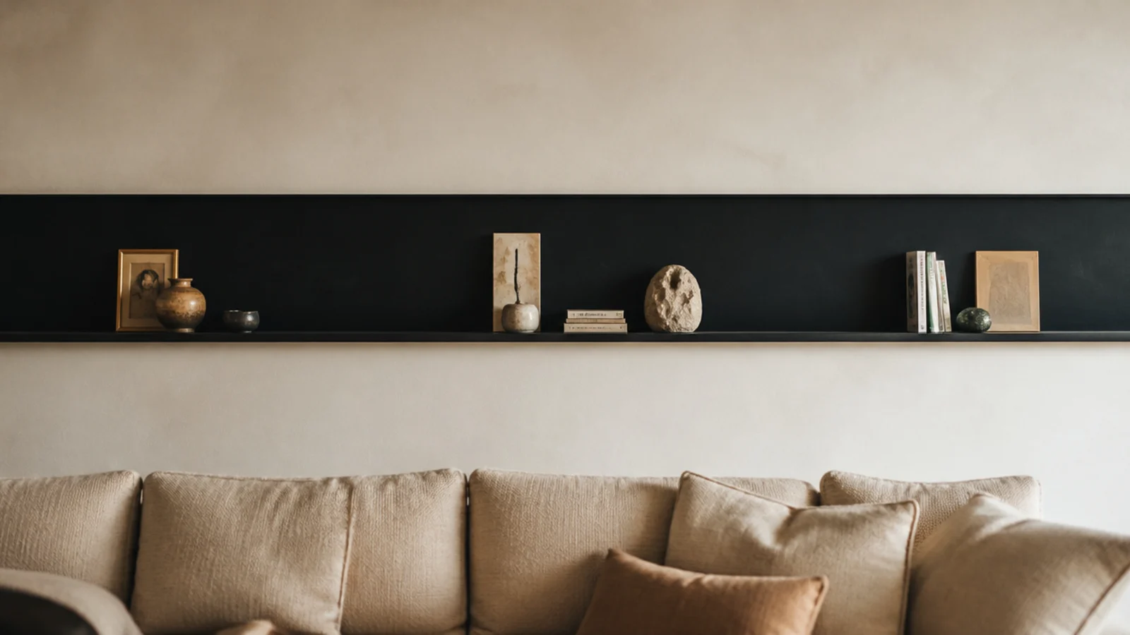 single long black shelf spanning an entire living room wall