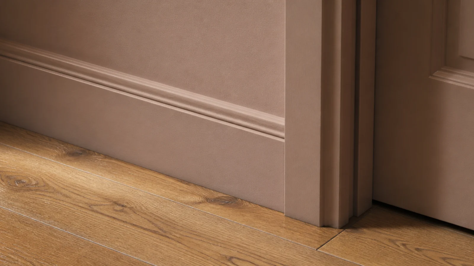 foyer baseboard and doorframe painted the same shade as the walls