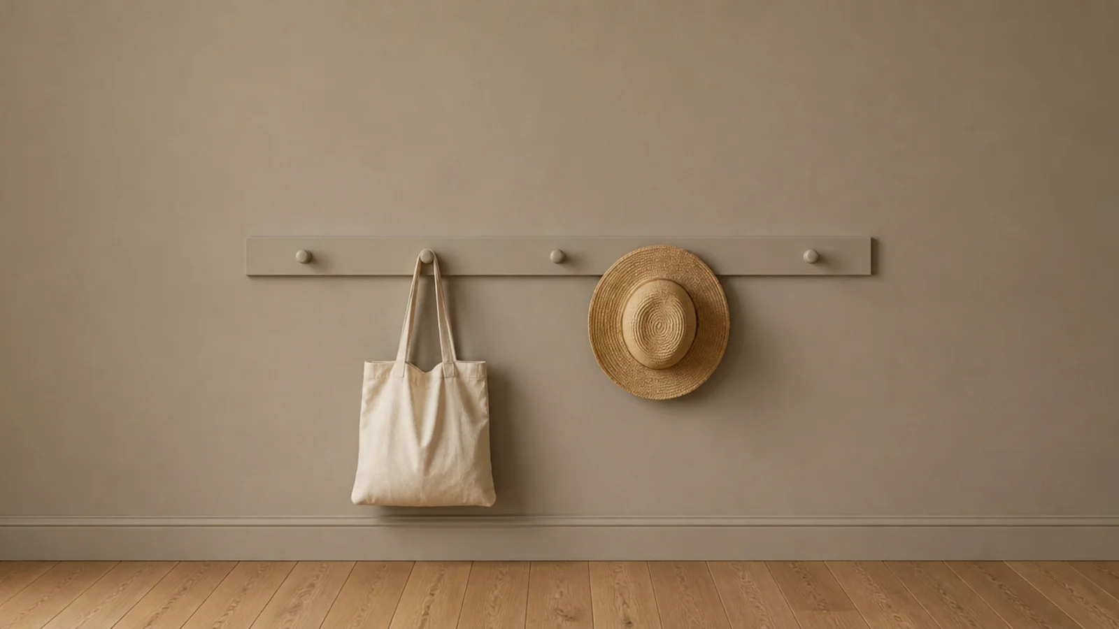 painted shaker peg rail mounted on a foyer wall holding a tote