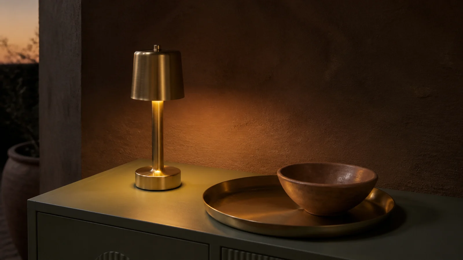 small cordless lamp glowing on a foyer console with no visible cable