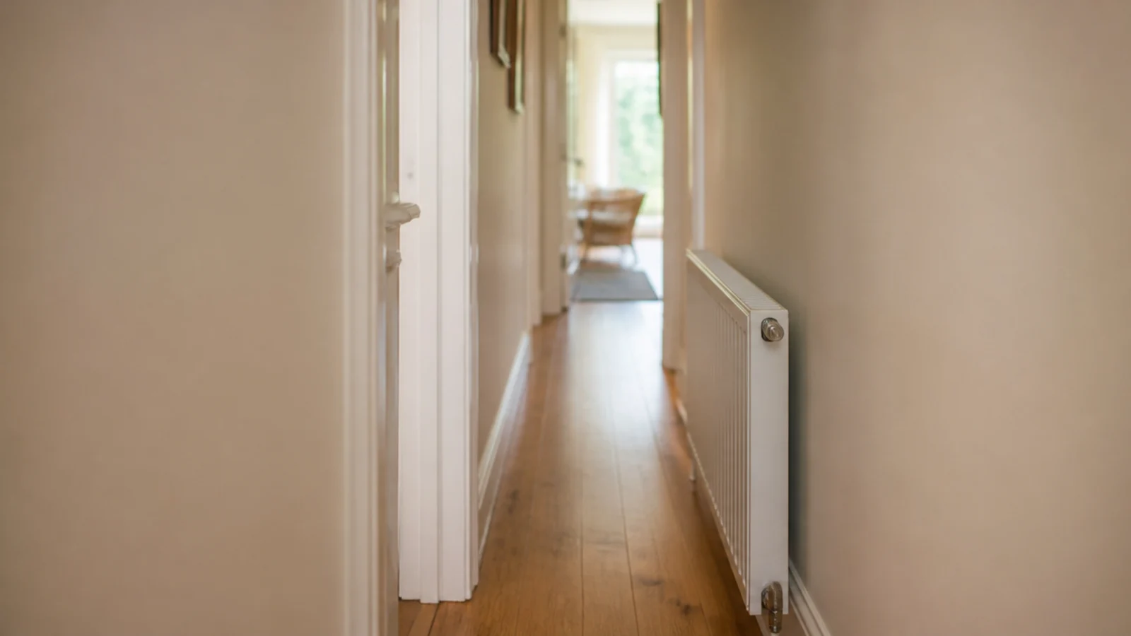 narrow hall measured beside a projecting doorframe and radiator
