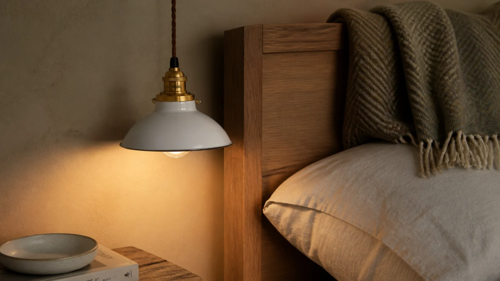 compact shade sized to sit beside a narrow bedroom headboard