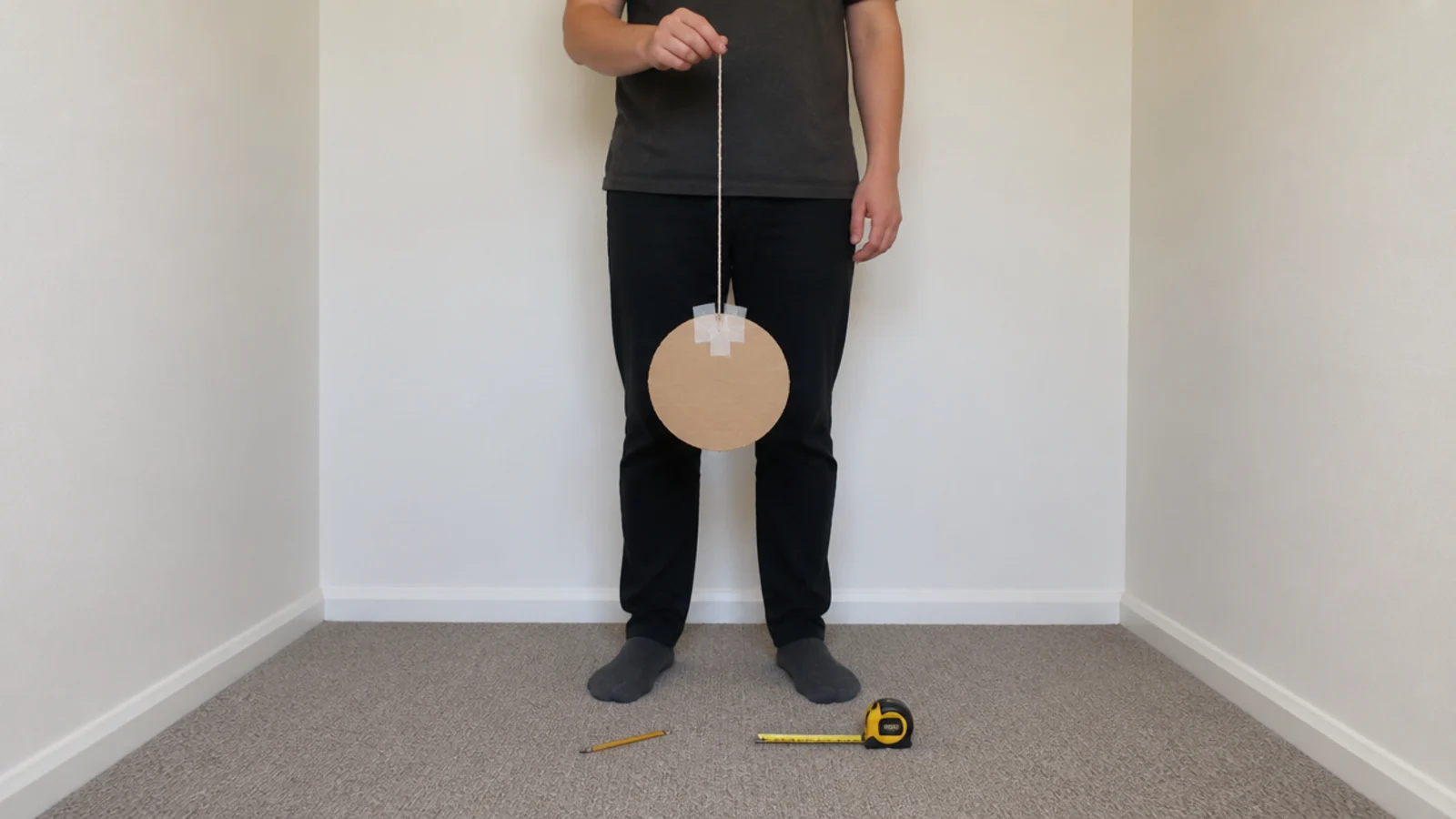 cardboard circle held at ceiling height to test a shade size