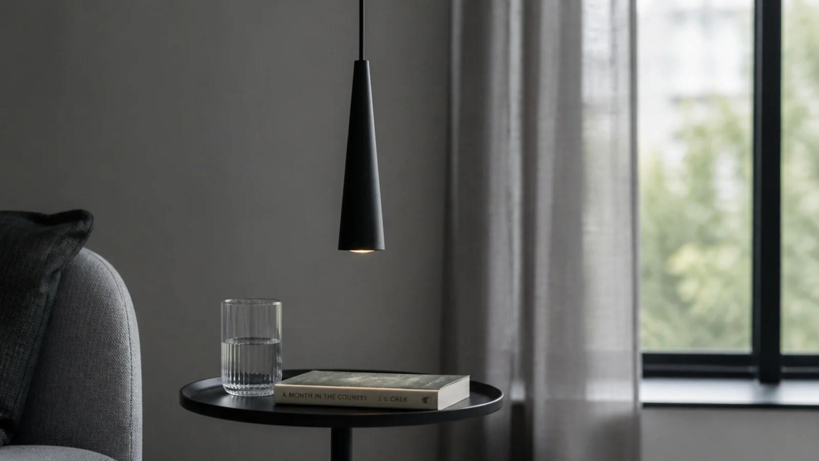 narrow metal cone pendant with a very small visual footprint