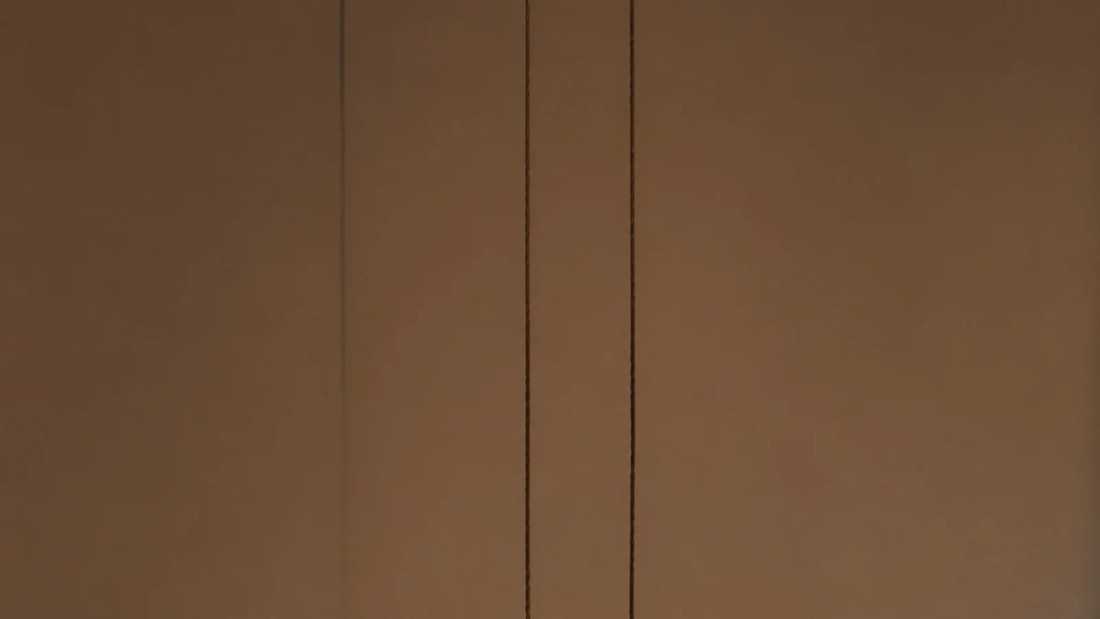 tall view of small hanging pendant lights in a compact interior