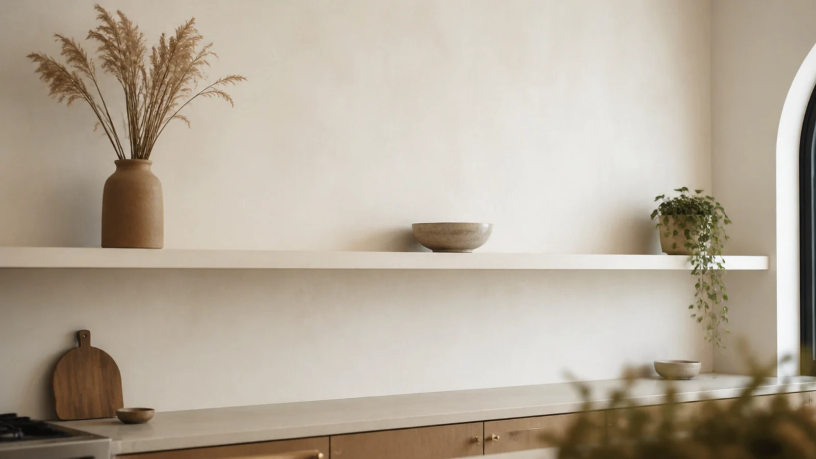 long modern kitchen shelf holding only three carefully chosen objects