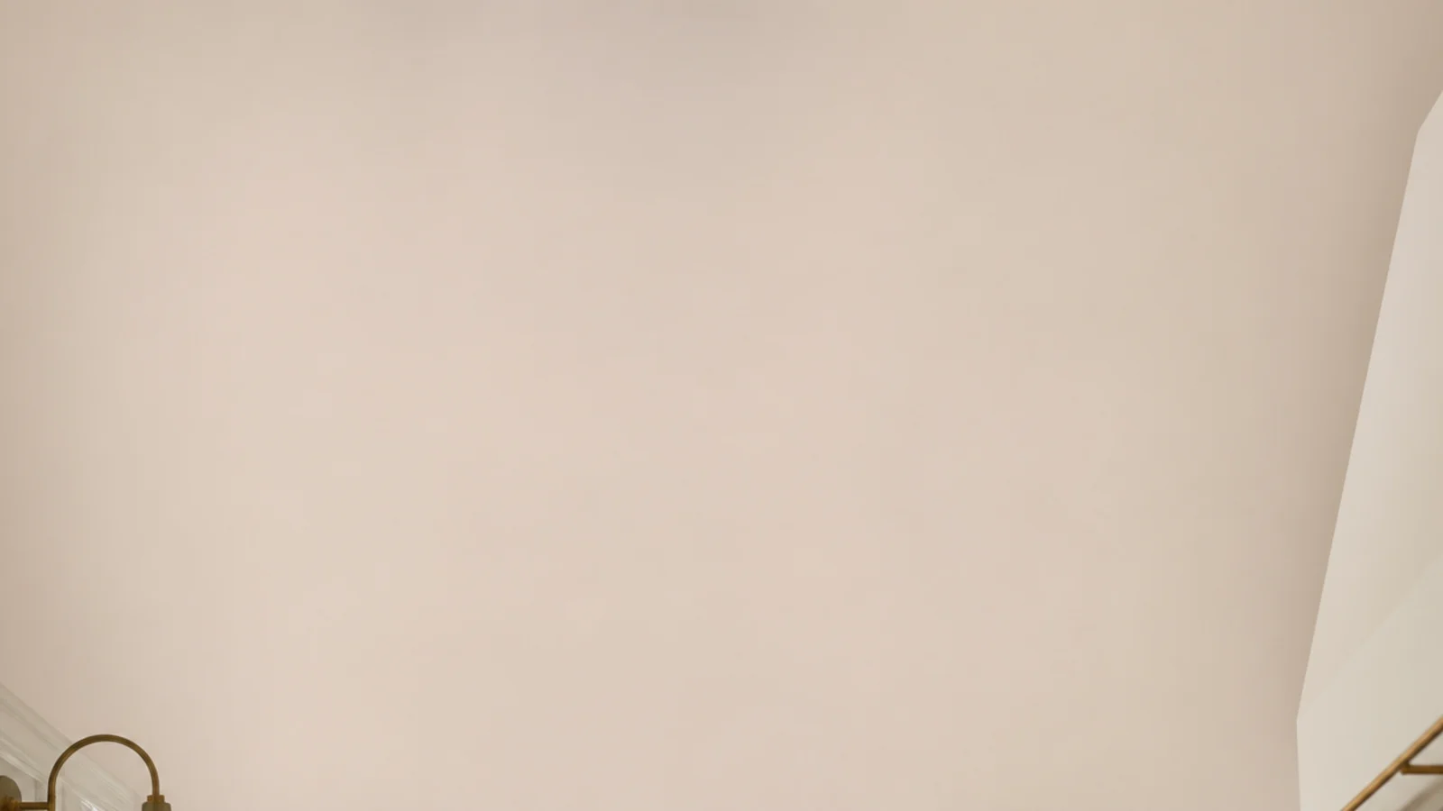 vertical view of small kitchen shelves fitted into narrow strips of wall