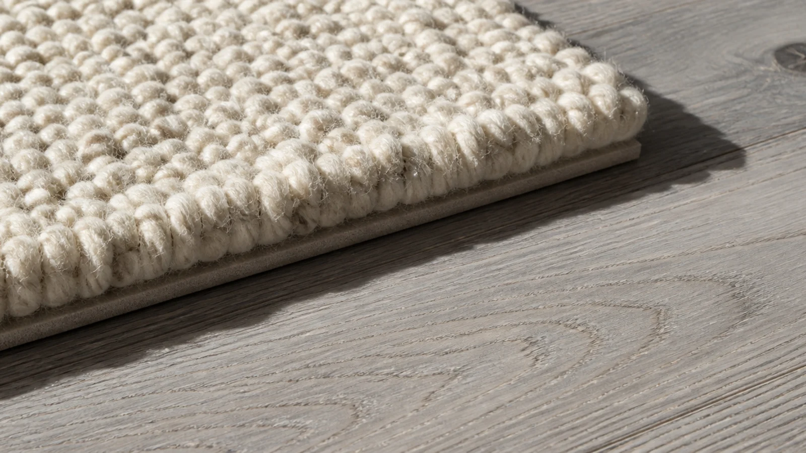 thicker top rug edge resting on a thin base showing a clear step
