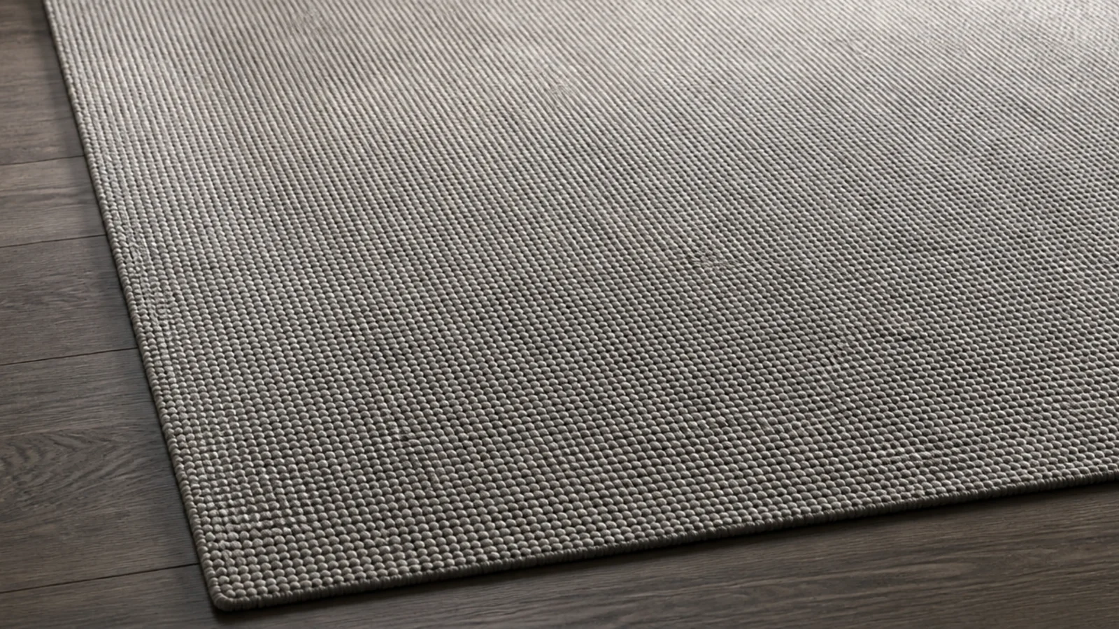 solid stone coloured rug with a visible textural weave structure