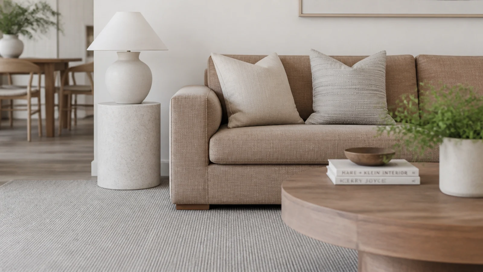pale grey rug matched to cool ash flooring in a bright room