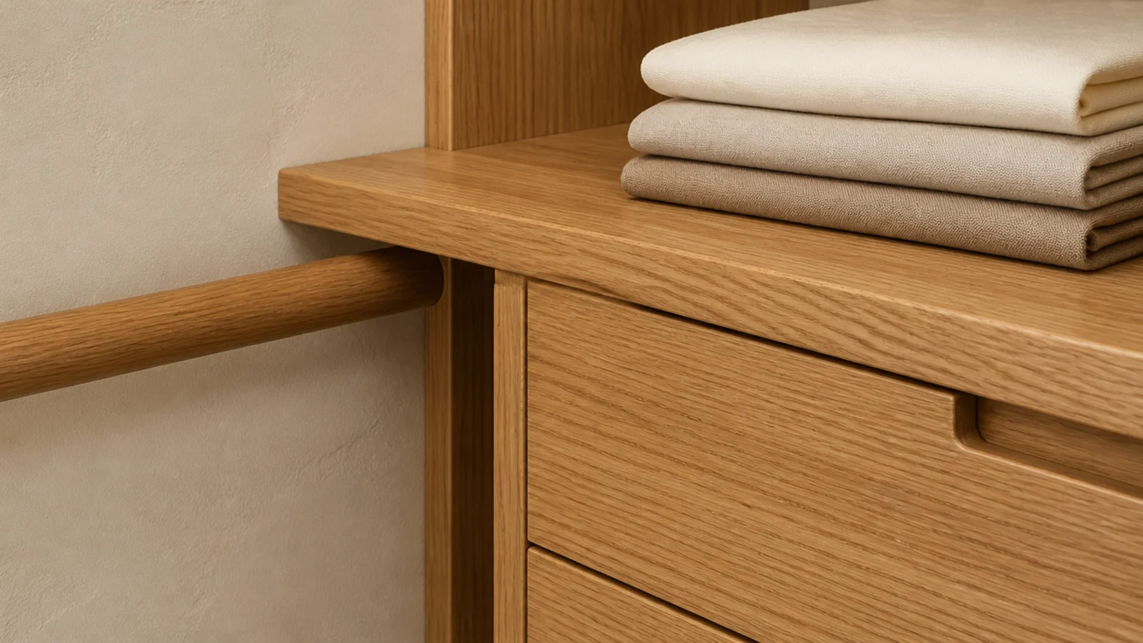 single warm oak tone repeated across rails shelves and drawer fronts