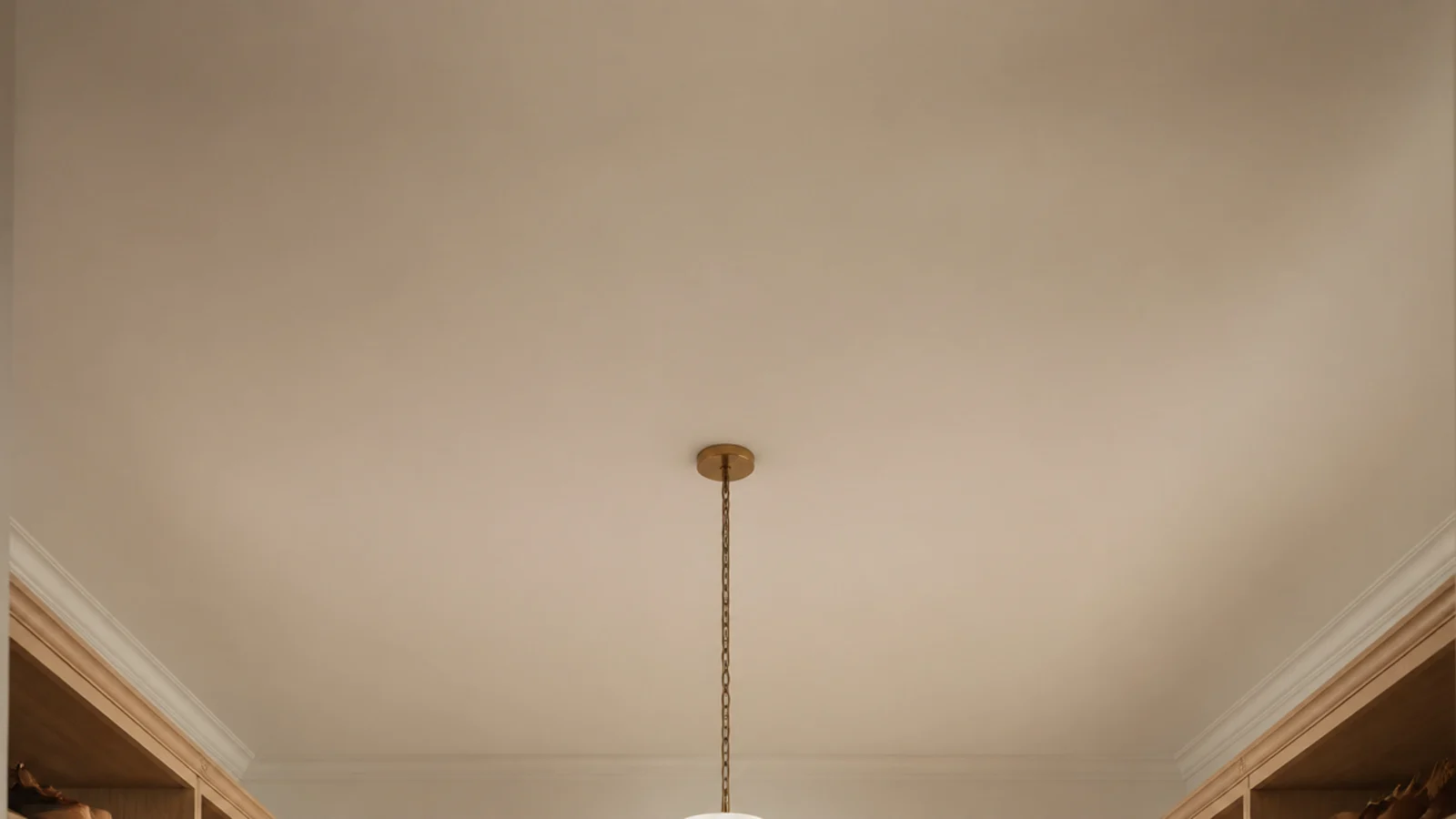 vertical view of a dreamy small walk-in closet with island and pendant