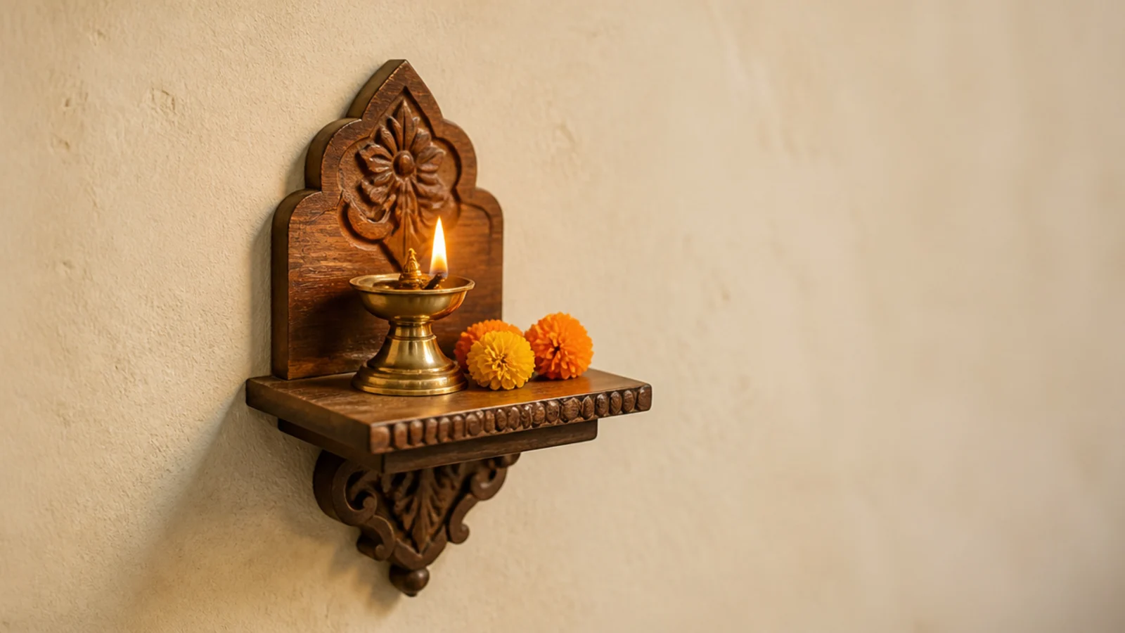 small wooden shelf with a lamp and flowers set apart from desk
