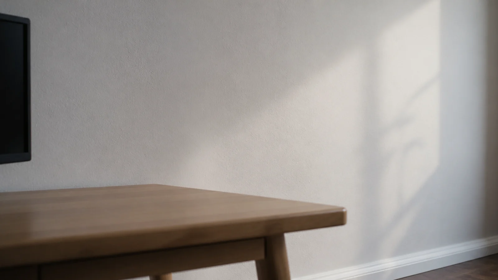 soft chalk white wall behind a desk with no sheen or pattern
