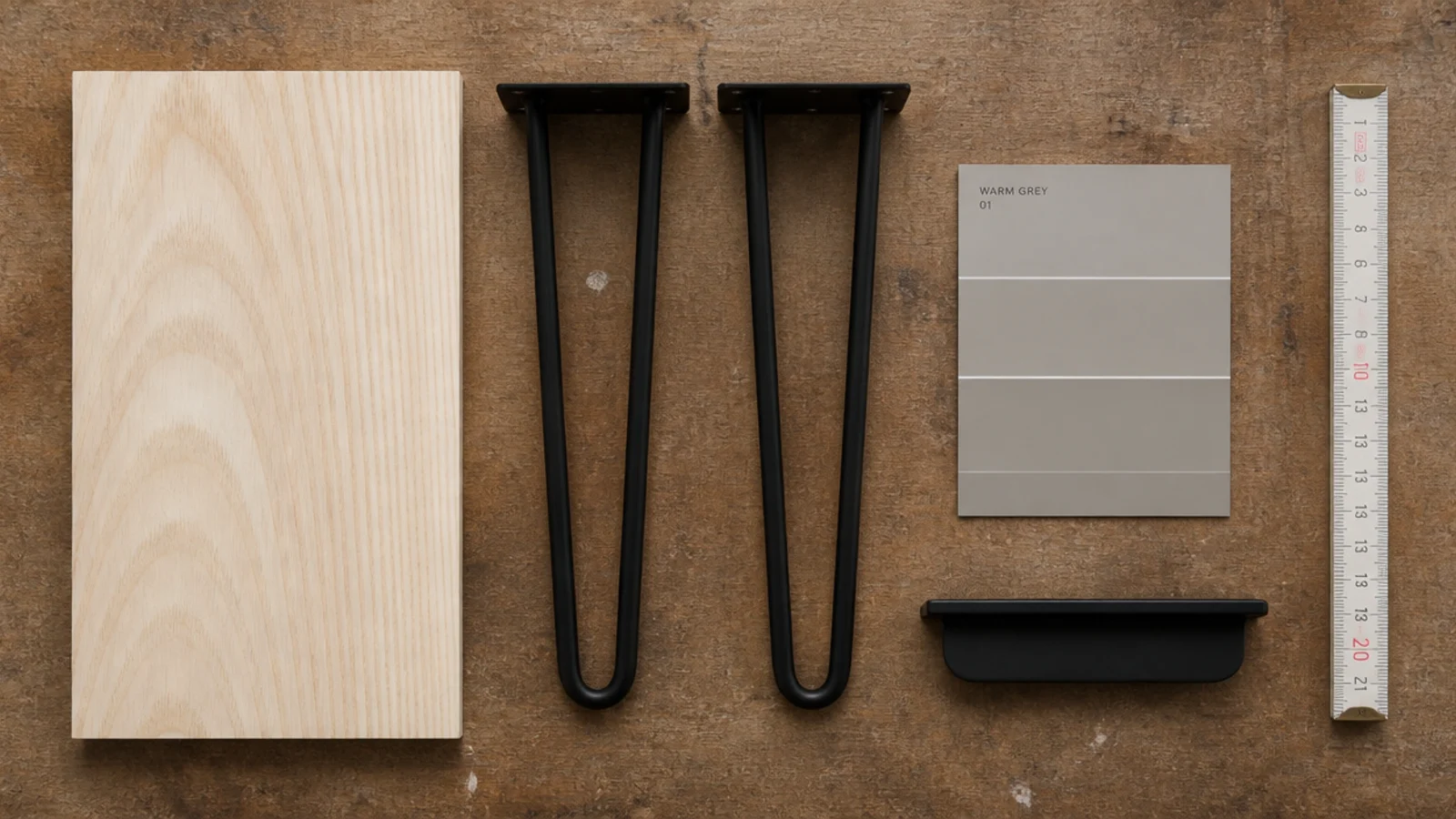 flat lay of ash board sample black legs paint chip and edge pull
