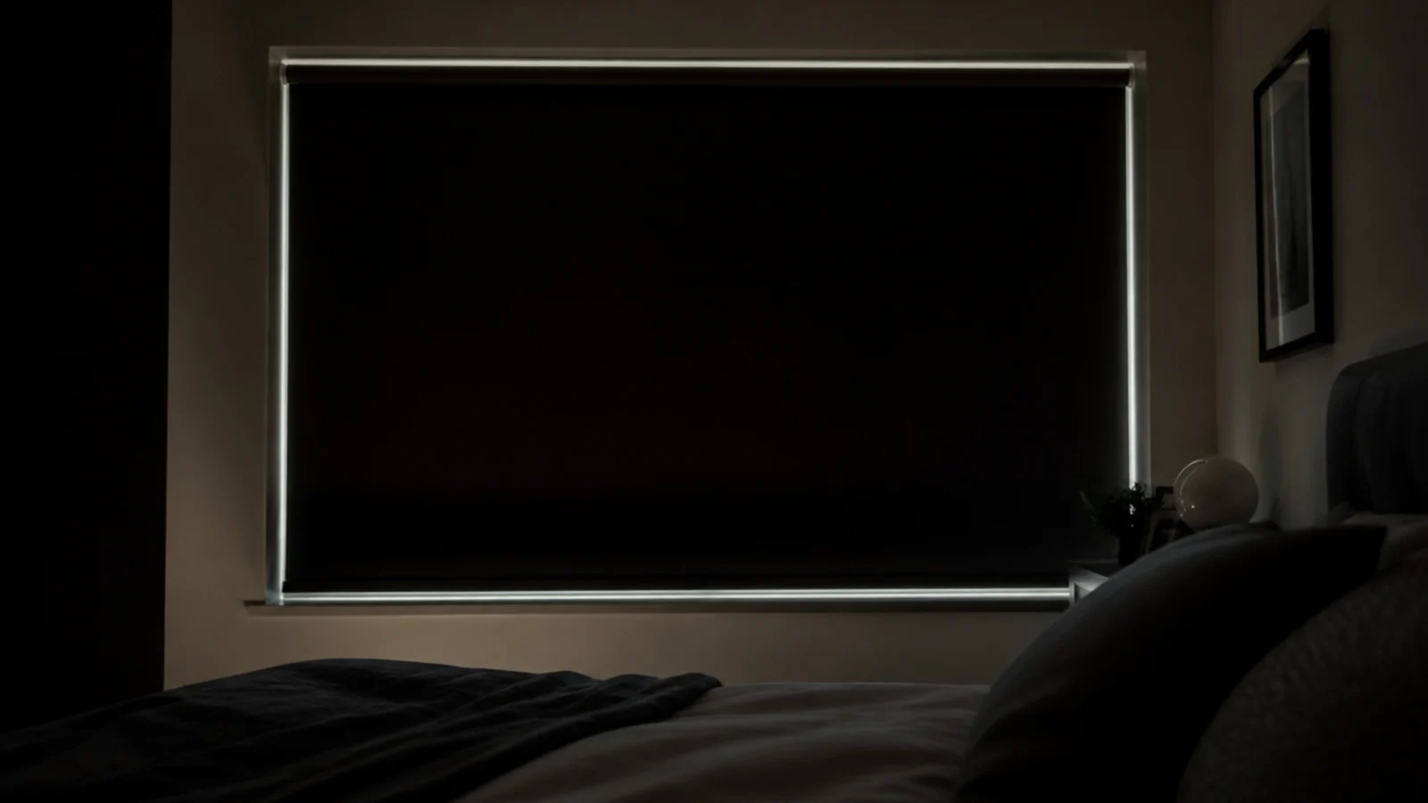 blackout blind fully drawn in a bright bedroom at midday