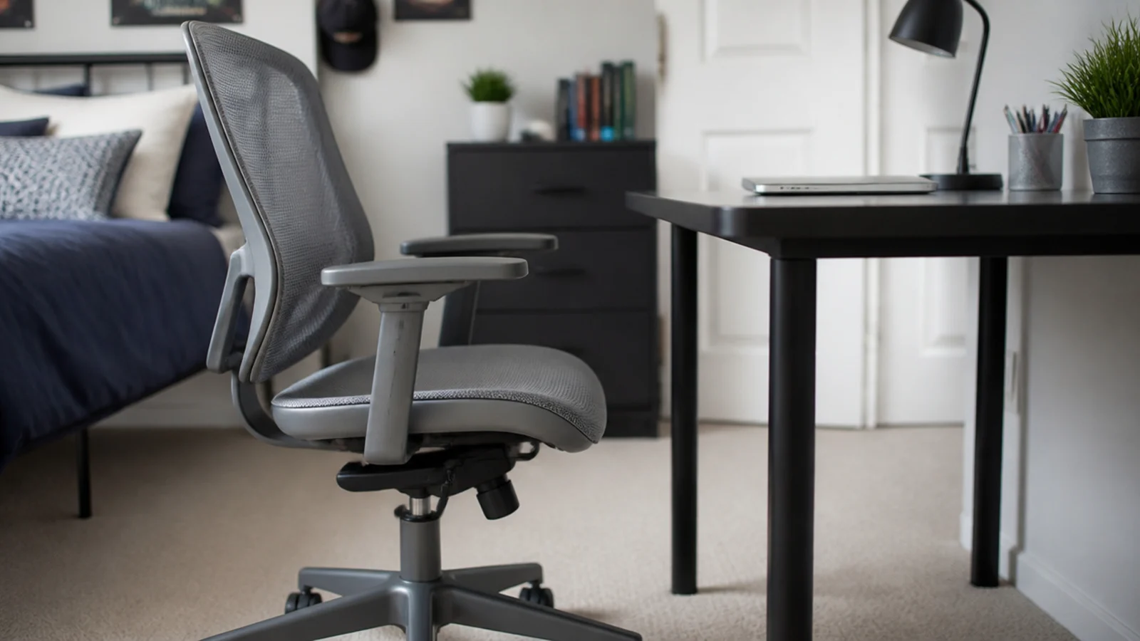mesh backed task chair with visible height and tilt adjustment levers
