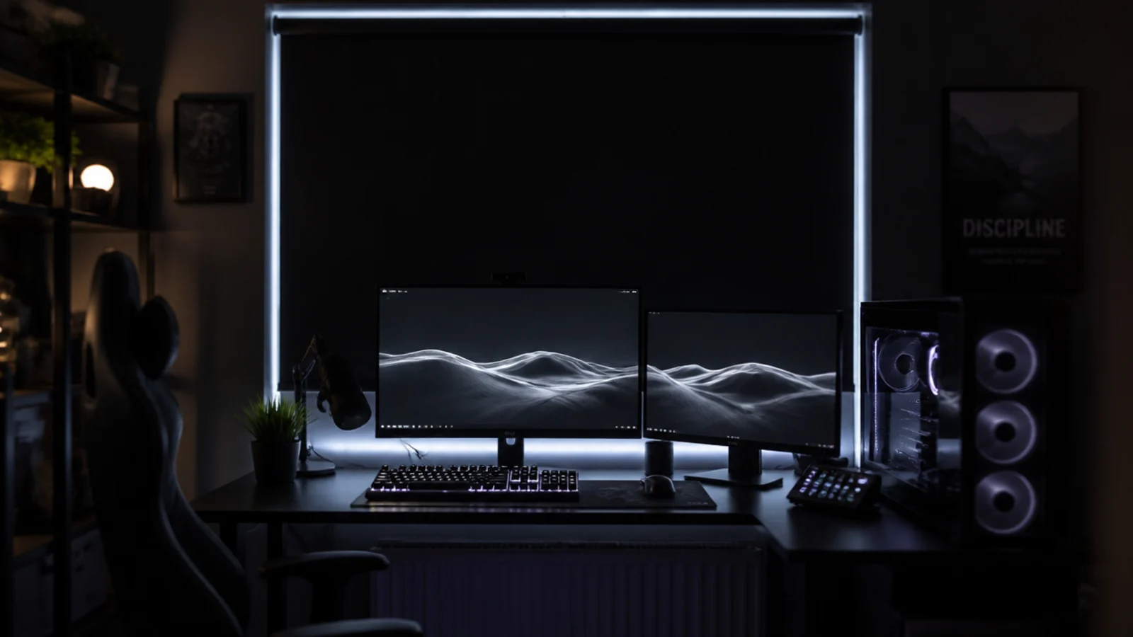 blackout blind fully drawn behind a lit gaming desk at midday
