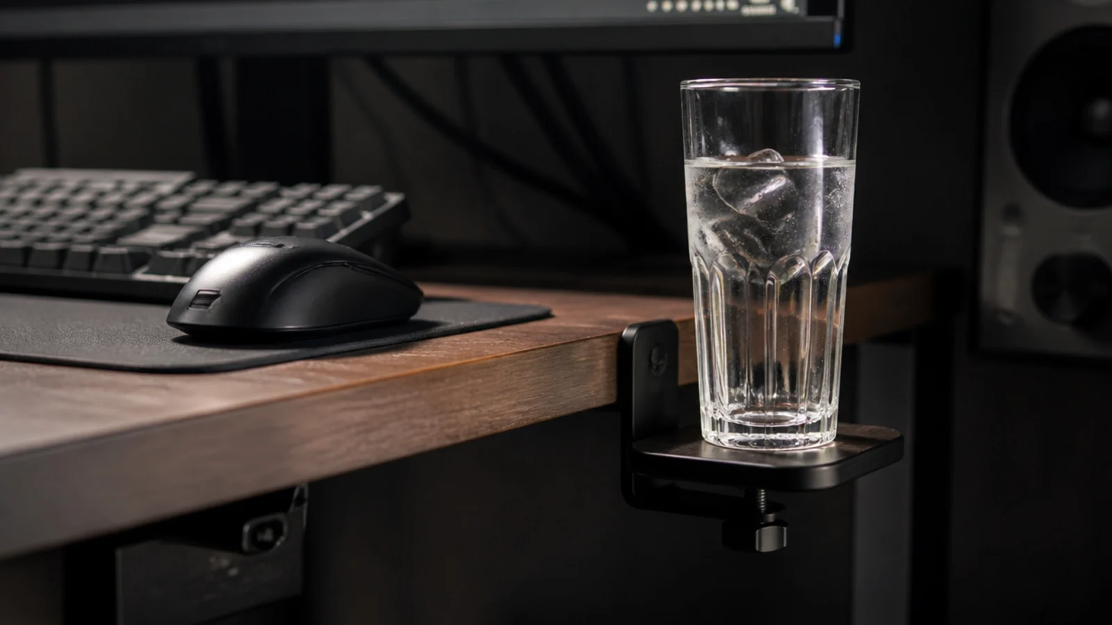 drink standing on a small side shelf below the level of a keyboard