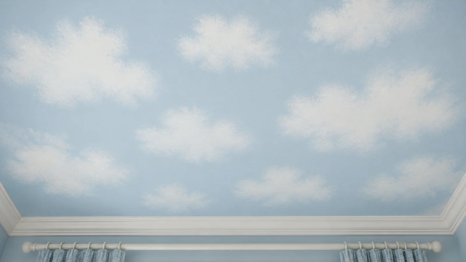 soft sponged clouds drifting across a pale blue bedroom ceiling