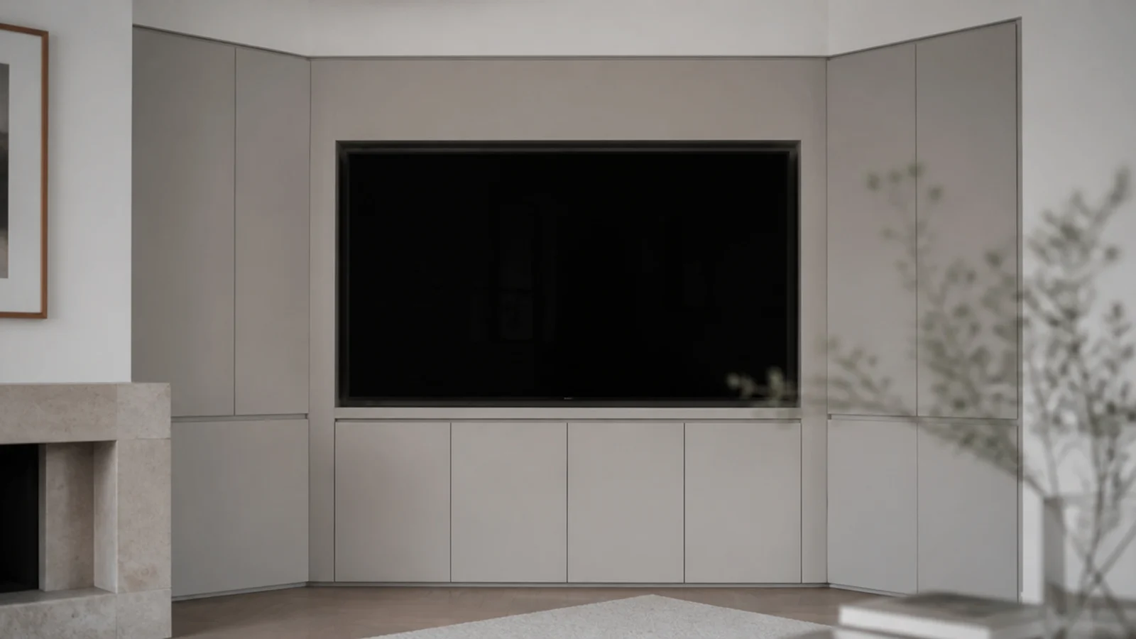 painted joinery filling an entire wall with a recessed screen centred