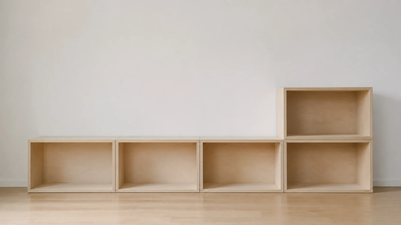 stacked modular media boxes forming a low run beneath a screen
