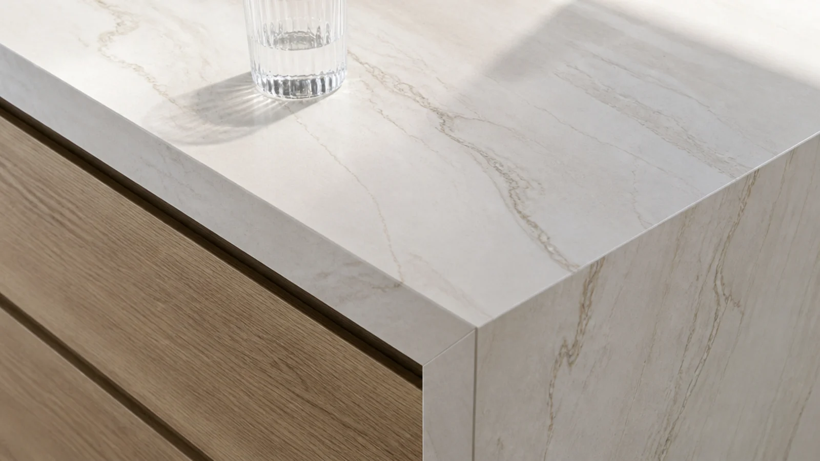 thin porcelain slab top on a modern media unit with a mitred edge