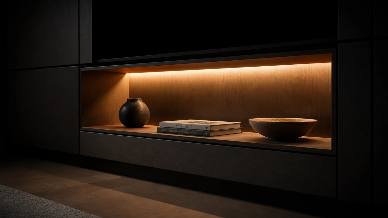 open cabinet bay lit softly from within by a concealed warm strip