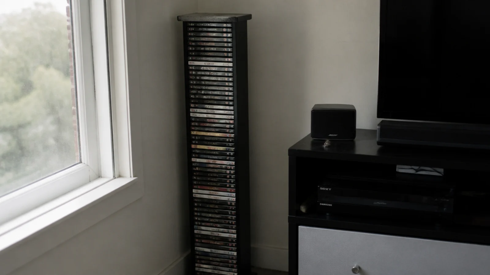 tall disc storage tower crowding the corner beside a media unit