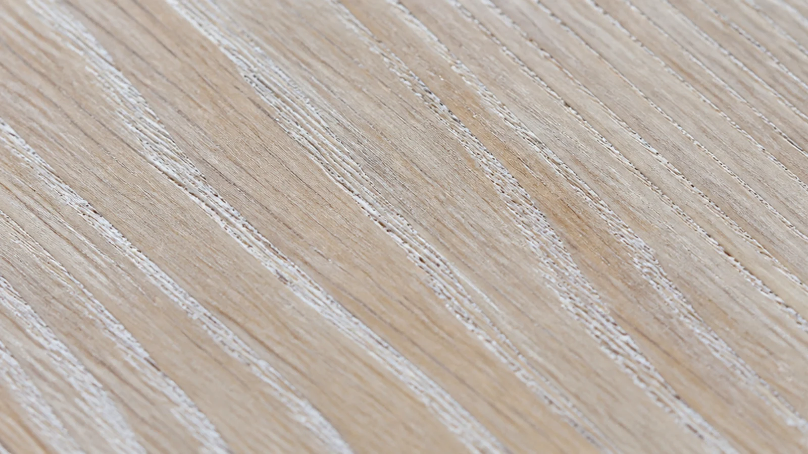 limed oak surface with white pigment sitting in the open grain