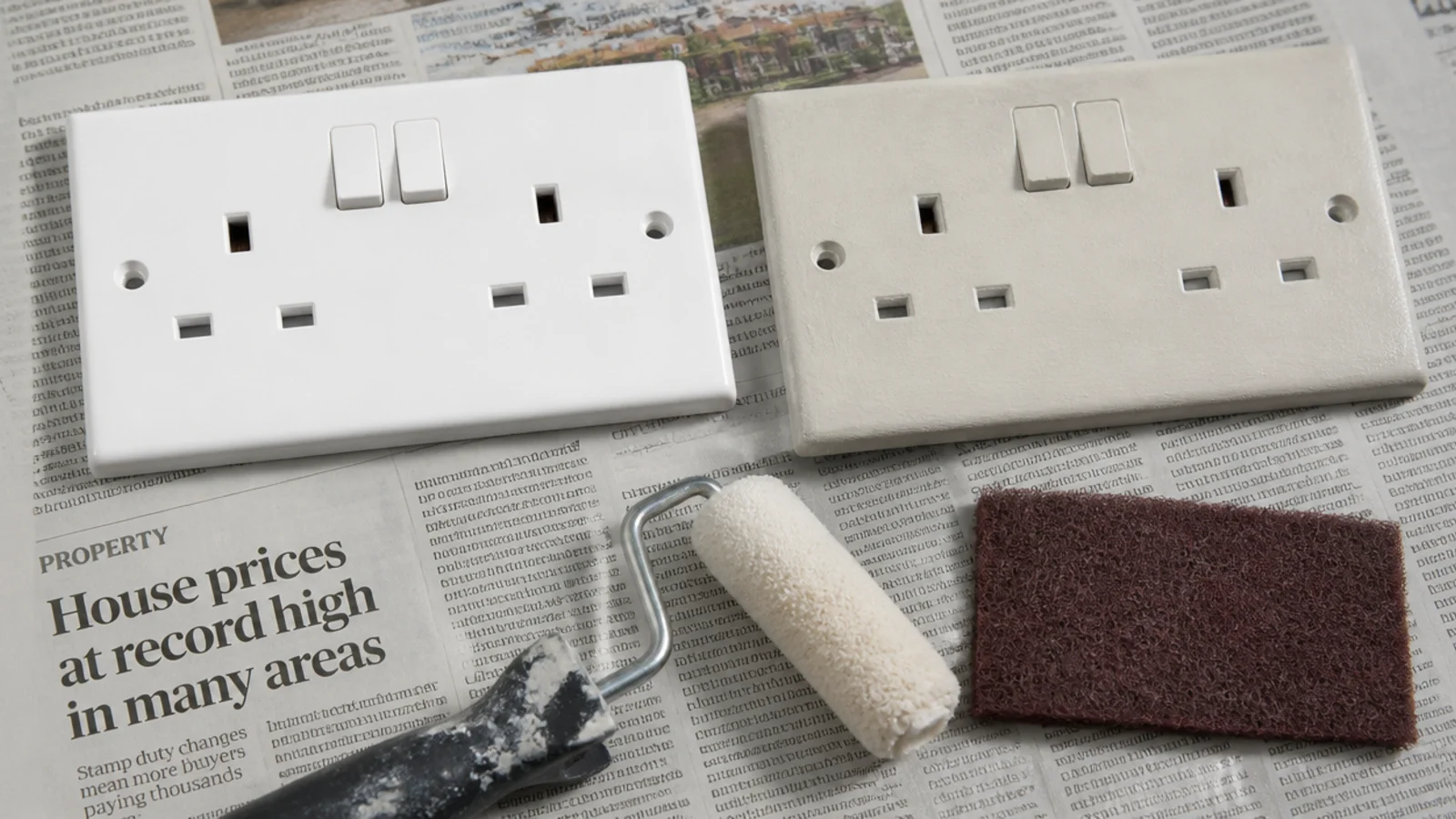 socket faceplate rolled in wall colour beside an unpainted white one