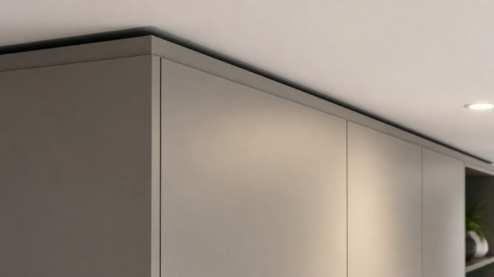 tall media joinery meeting the ceiling with a crisp shadow gap