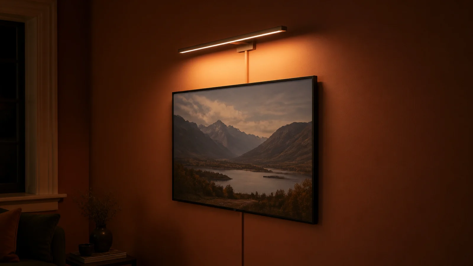 plug in picture light fixed above a screen on a painted wall