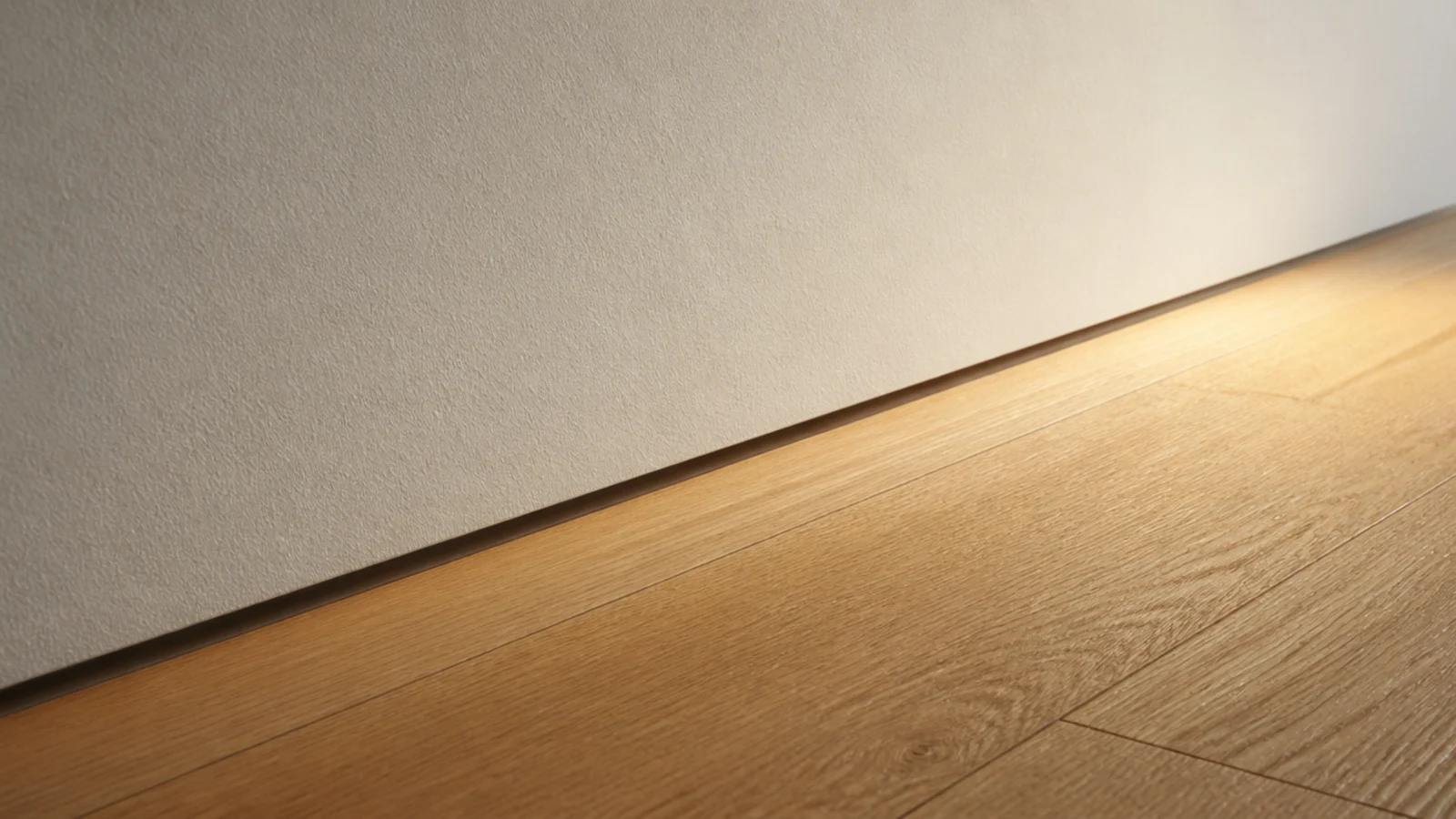 thin recessed gap running along the base of a wall instead of skirting