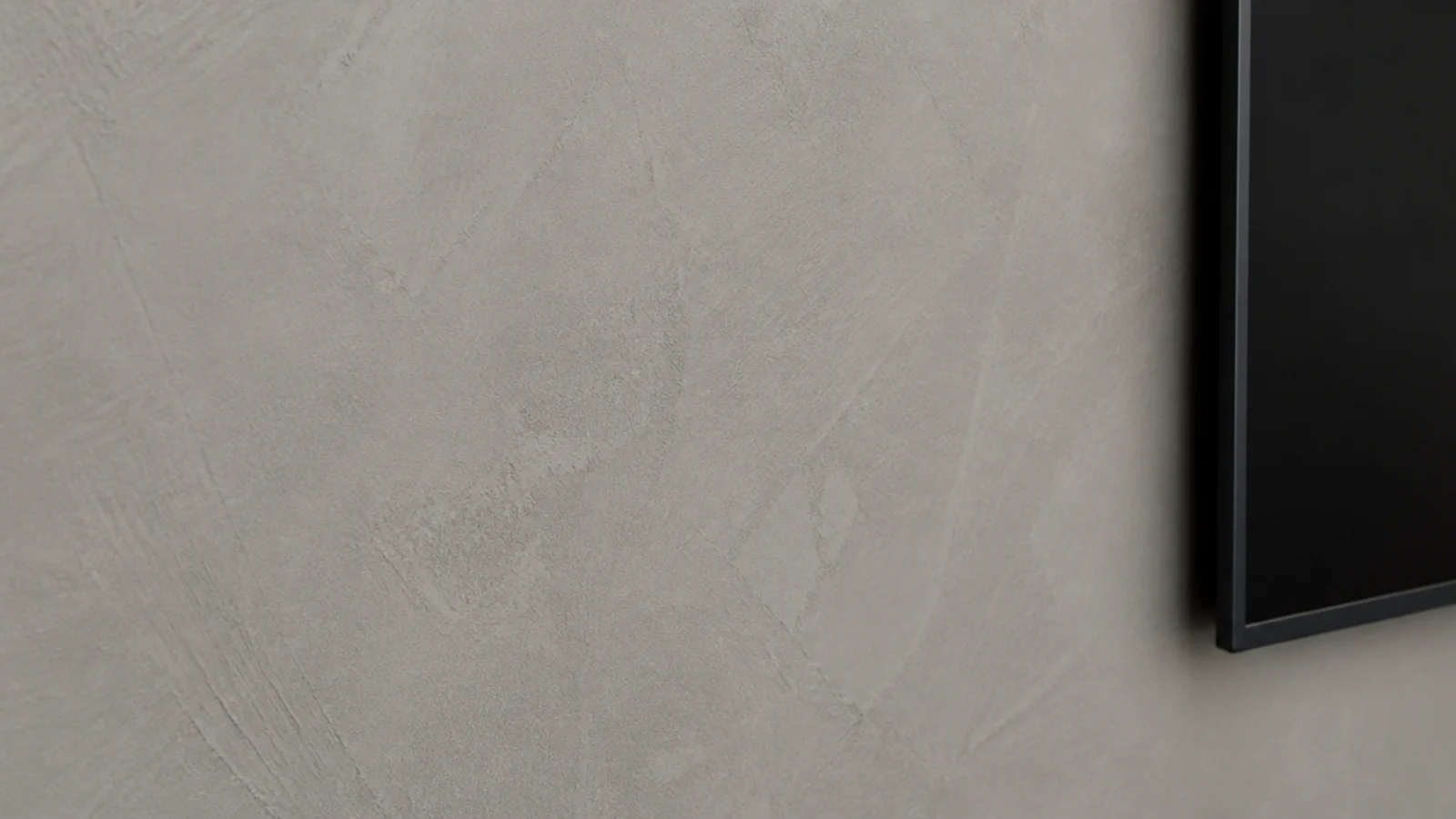 troweled micro cement wall in warm grey with soft mottled movement