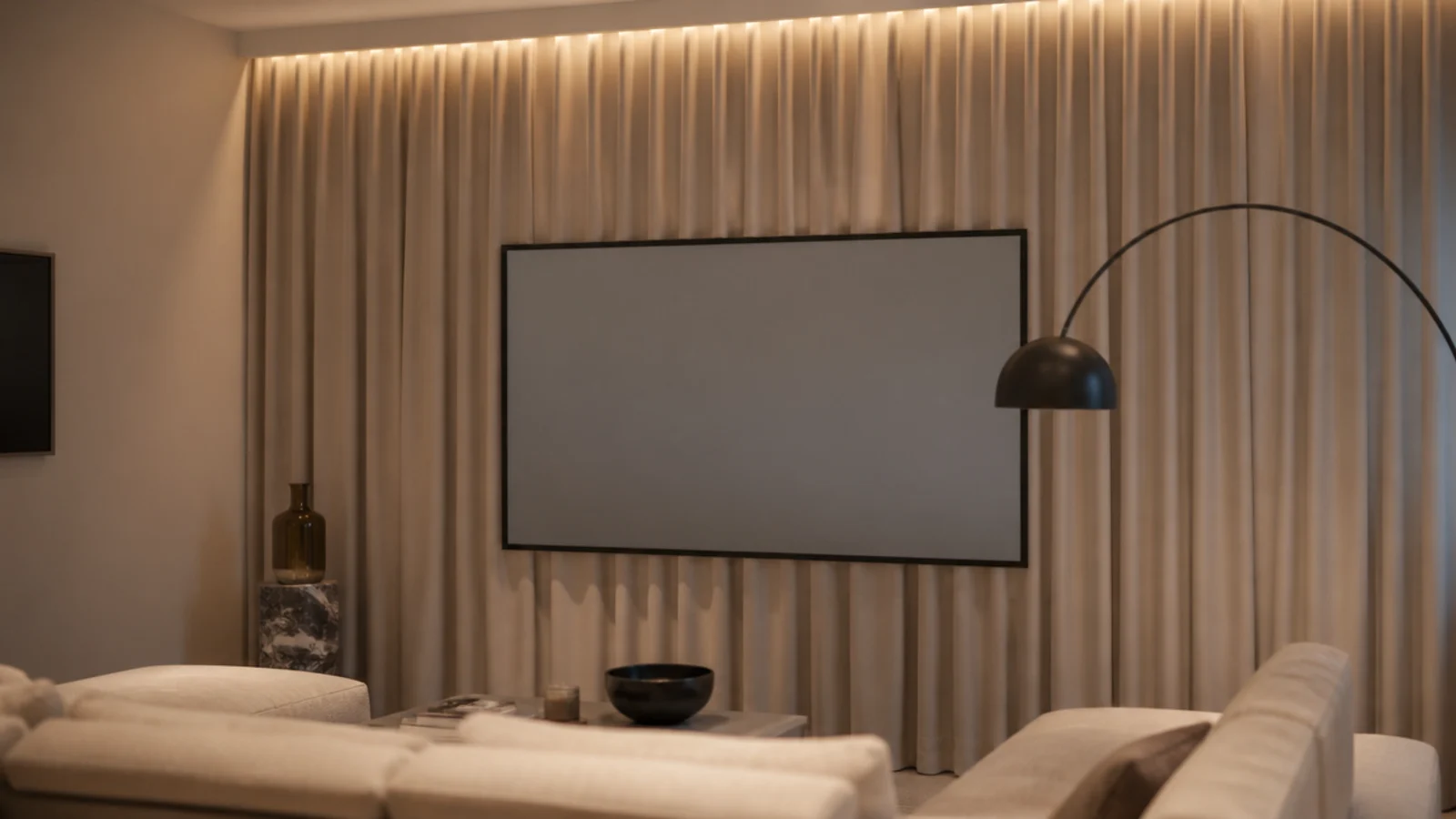 floor to ceiling curtain running behind a screen in a small flat